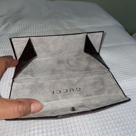 brown leather monogrammed foldable eyeglasses case from Gucci. - Picture 7 of 16